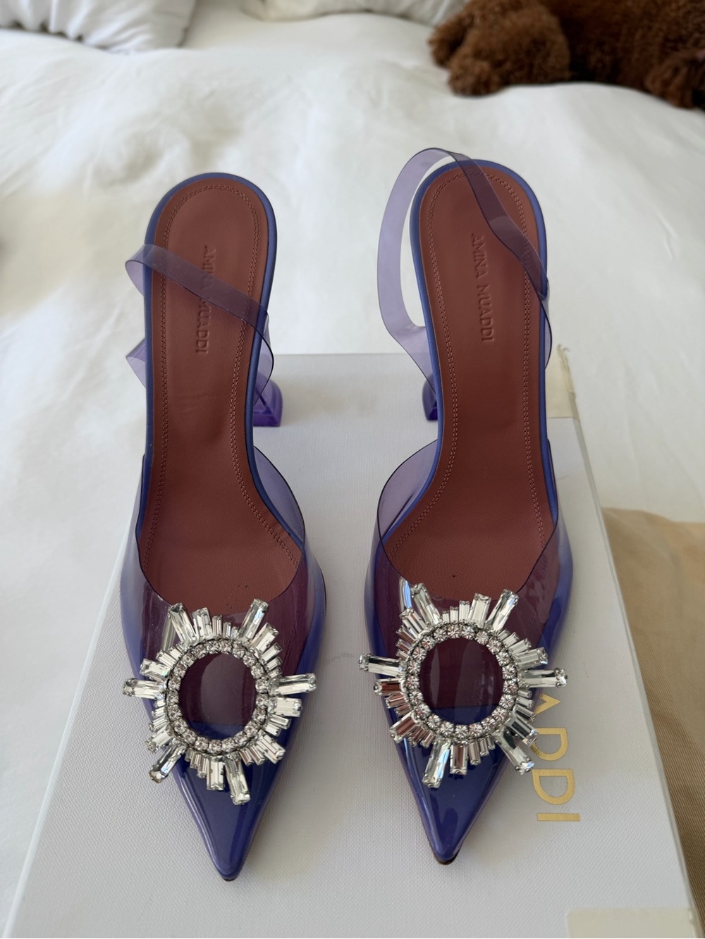 Amina Muaddi Purple PVC Pointed Slingback Heels with Crystal Sunburst